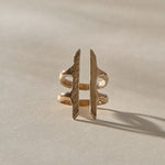 Akash Shield Statement Ring in recycled bronze from the front, two carved bars joined by a double band.