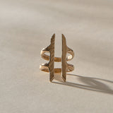 Akash Shield Statement Ring in recycled bronze from the front, two carved bars joined by a double band.