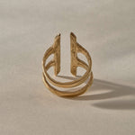 Akash Shield Statement Ring in solid recycled gold from the side, showing the open double band.