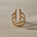 Akash Shield Statement Ring in solid recycled gold from the side, showing the open double band.