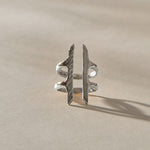 Akash Shield Statement Ring in recycled sterling silver from the front, two carved bars joined by a double band.