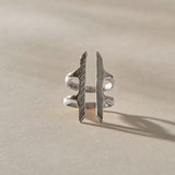 Akash Shield Statement Ring in recycled sterling silver from the front, two carved bars joined by a double band.