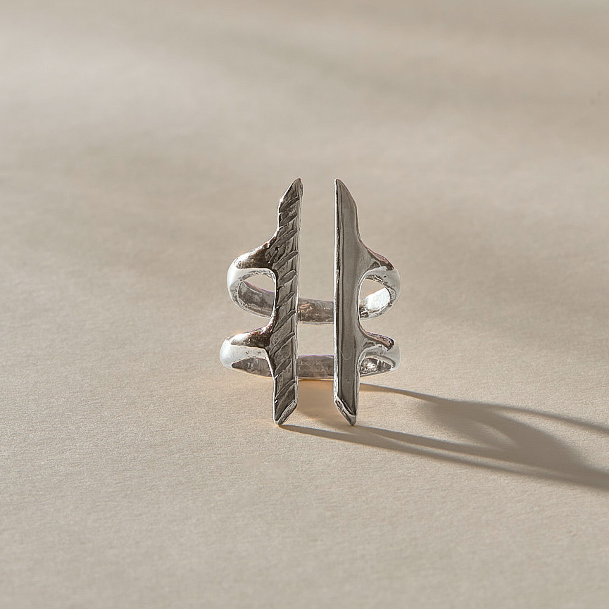 Akash Shield Statement Ring in recycled sterling silver from the front, two carved bars joined by a double band.