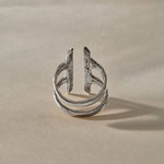 Akash Shield Statement Ring in recycled sterling silver from the side, showing the open double band.