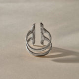 Akash Shield Statement Ring in recycled sterling silver from the side, showing the open double band.