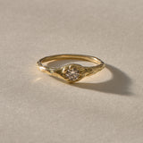 Ama Champagne Diamond Ring in gold at an angle, showing the delicate band and diamond setting.