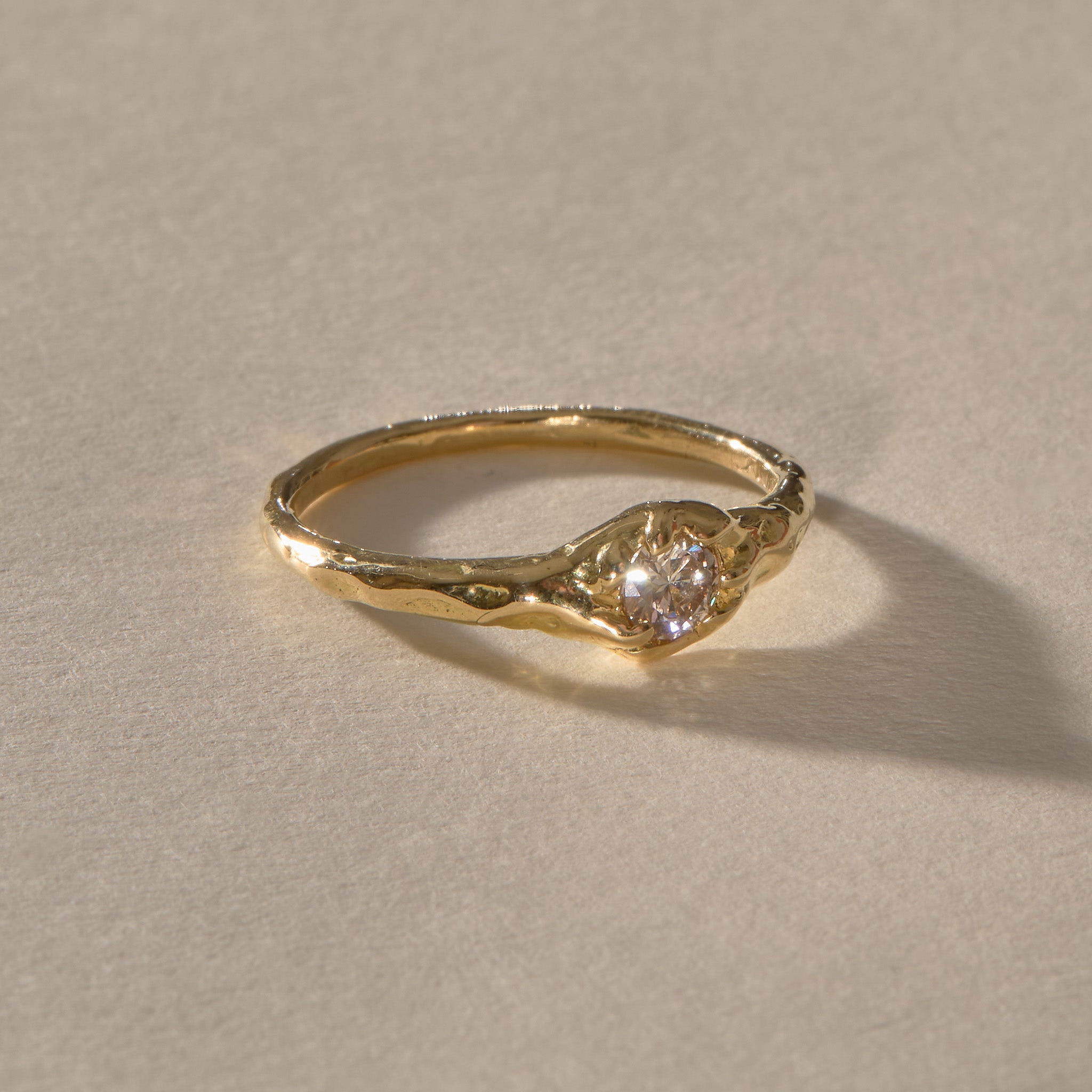 Ama Champagne Diamond Ring in gold from the front, showing the brilliant cut champagne diamond.
