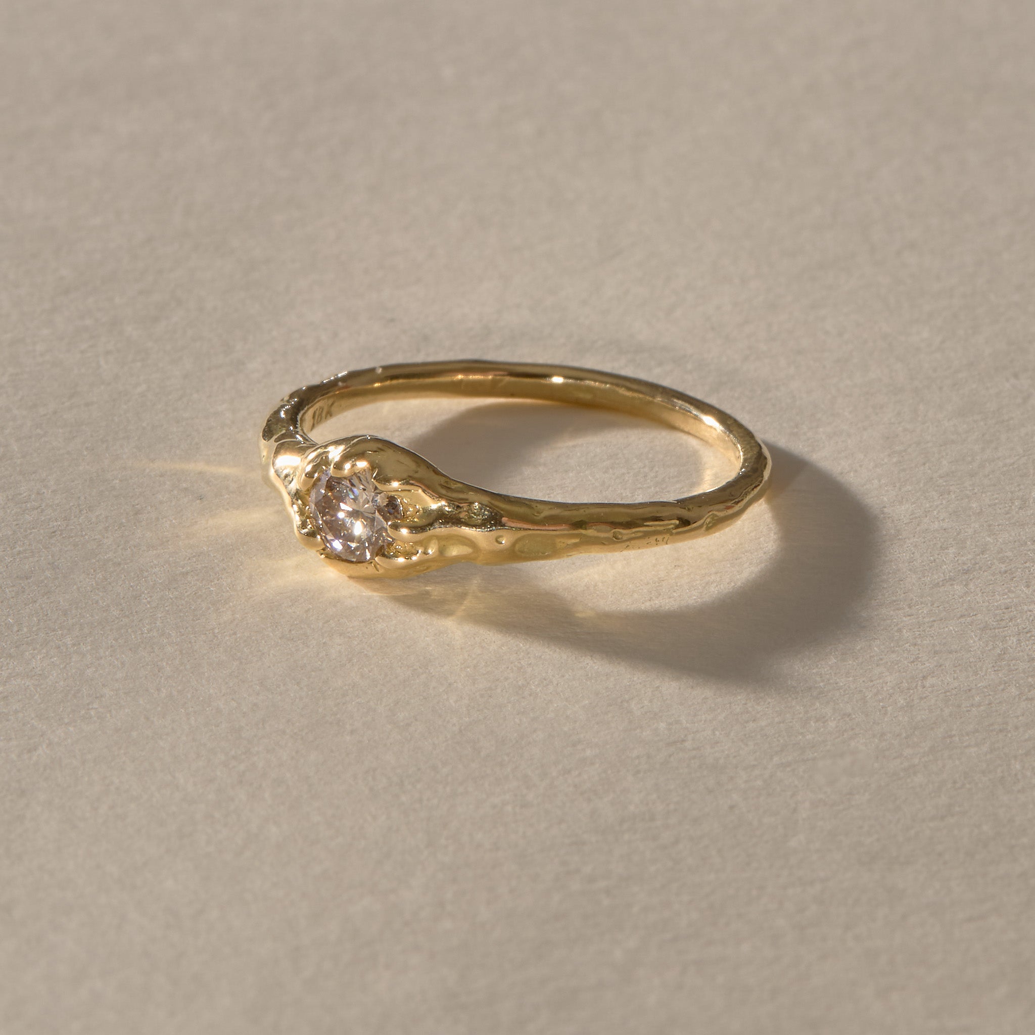 Ama Champagne Diamond Ring in solid recycled gold, a natural champagne diamond set in an organic textured band.