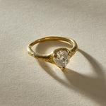 Amara raw diamond ring at an angle, showing the textured shoulders of the 18k gold band.