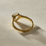 Back of the Amara Ring, showing the hand-finished 18k gold setting beneath the raw diamond.