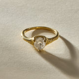 Amara polished raw diamond ring in 18k gold from the front, showing the natural, cloudy character of the stone.