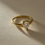 Amara Ring in 18k recycled gold with a 2.28ct polished raw Canadian diamond and a molten organic band, in soft sunlight.
