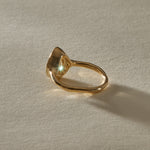 Aurum Pear Diamond Ring from the side, showing the soft bezel and slim gold band.
