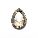 Close up of the champagne salt and pepper pear rose cut diamond showing its natural inclusions.