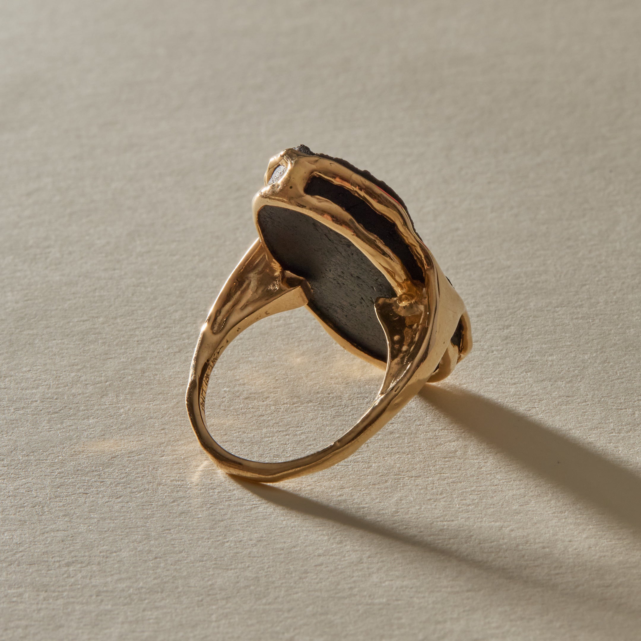 Black Tourmaline Amulet Ring XIX from a rear angle, showing the double band and open back setting.