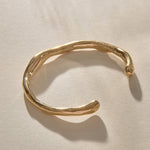 Bone Cuff Bracelet in recycled gold, a sculptural open cuff with an organic, bone-like form.
