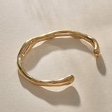 Bone Cuff Bracelet in recycled gold, a sculptural open cuff with an organic, bone-like form.