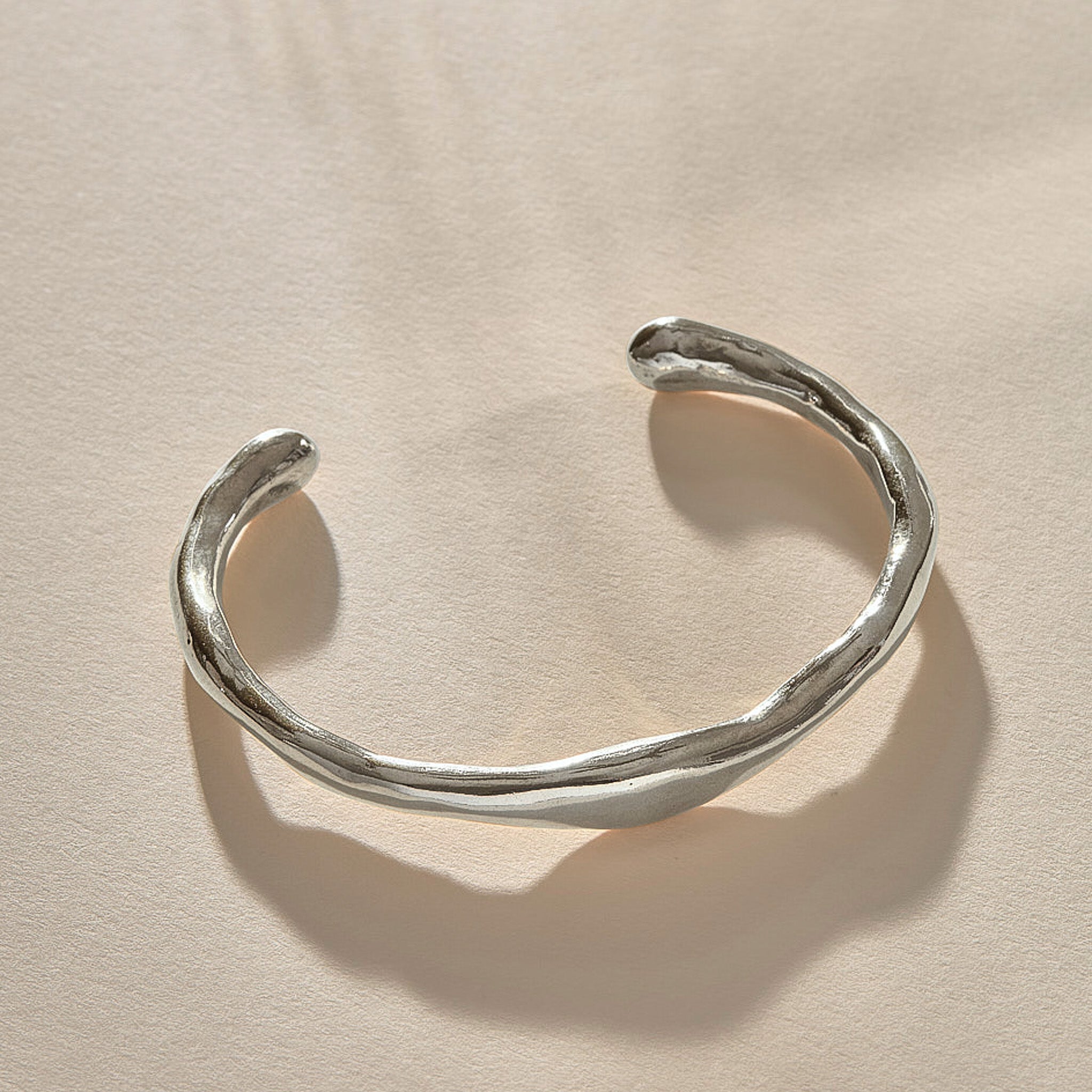 Bone Cuff Bracelet in recycled sterling silver, a sculptural open cuff with an organic, bone-like form.