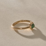 Cosmos Emerald Ring in solid recycled gold from the side, showing the slim, gently curved band.