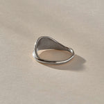 Devotions Wave Ring in recycled sterling silver from the front, an organic band rising like an ocean wave.