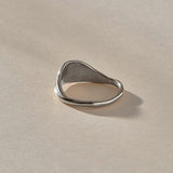 Devotions Wave Ring in recycled sterling silver from the front, an organic band rising like an ocean wave.