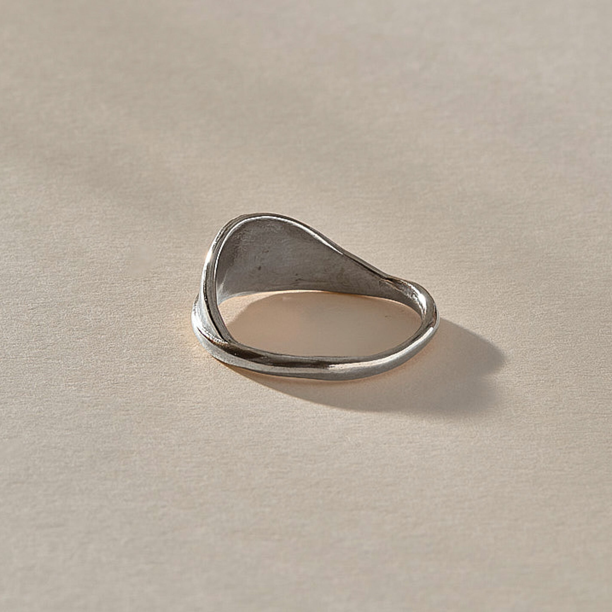 Devotions Wave Ring in recycled sterling silver from the front, an organic band rising like an ocean wave.