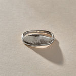 Devotions Wave Ring in recycled sterling silver from the side, showing the textured wave face.