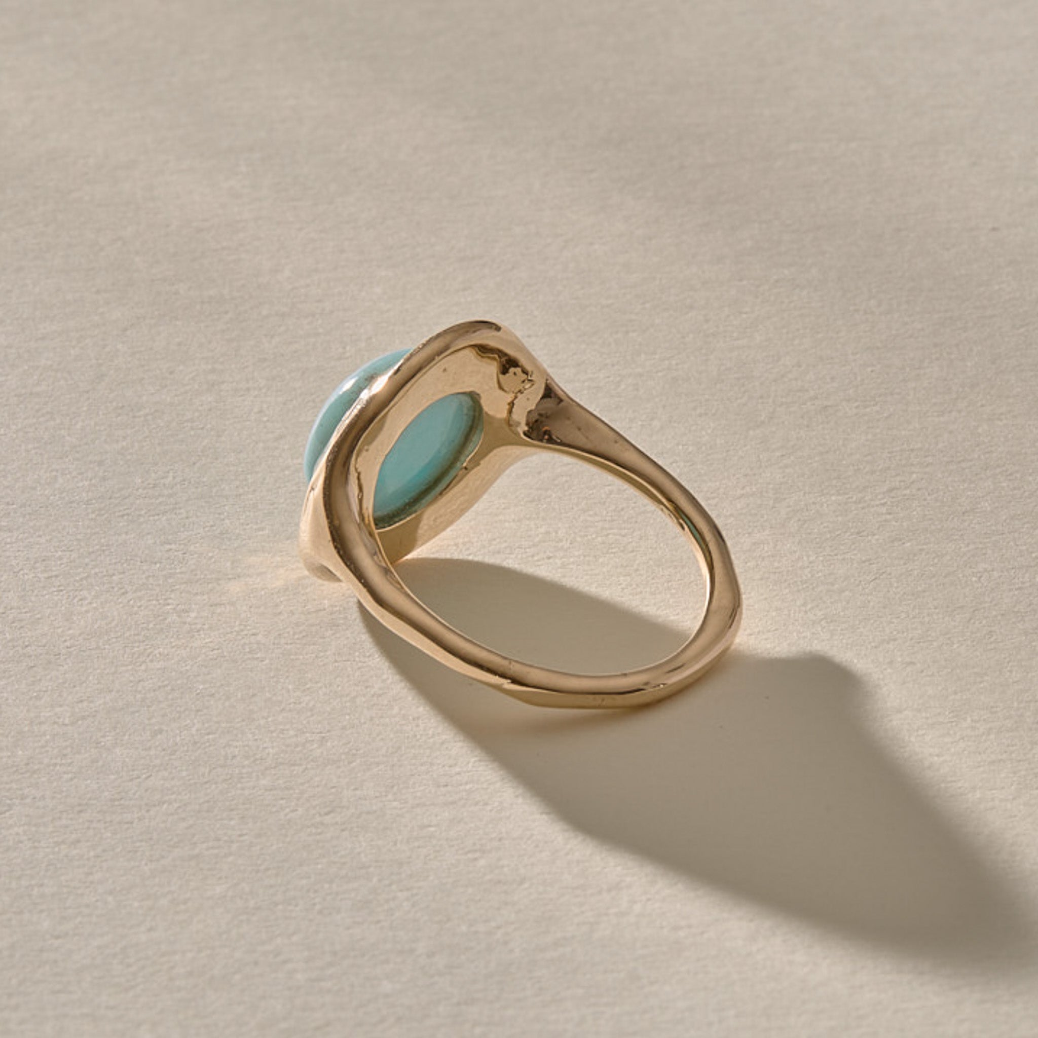 Elysian Larimar Signet Ring in solid recycled gold from the back at an angle, showing the band.