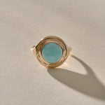 Elysian Larimar Signet Ring in solid recycled gold from the front, a round blue larimar stone in a textured signet setting.