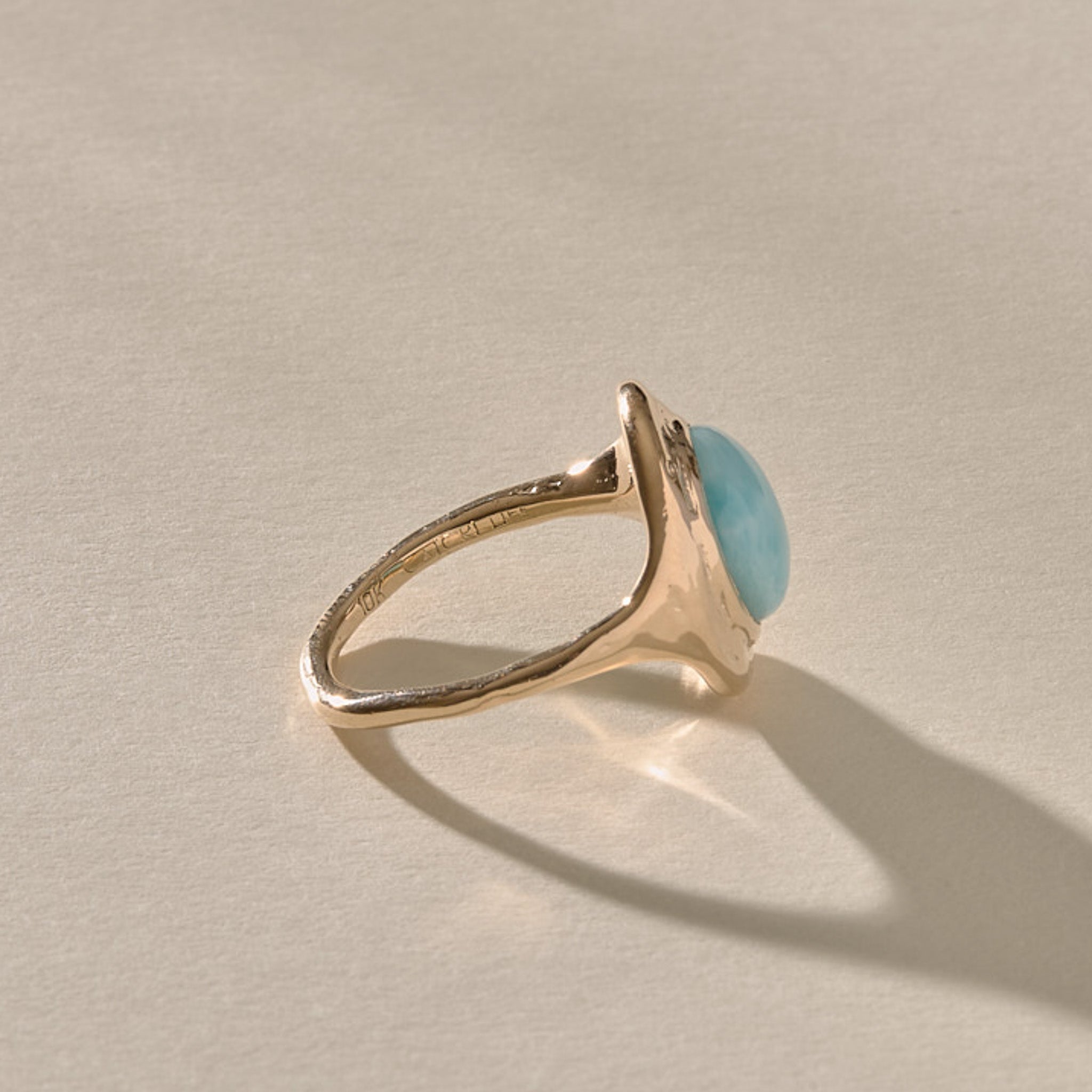 Elysian Larimar Signet Ring in solid recycled gold from the side, showing the signet profile.