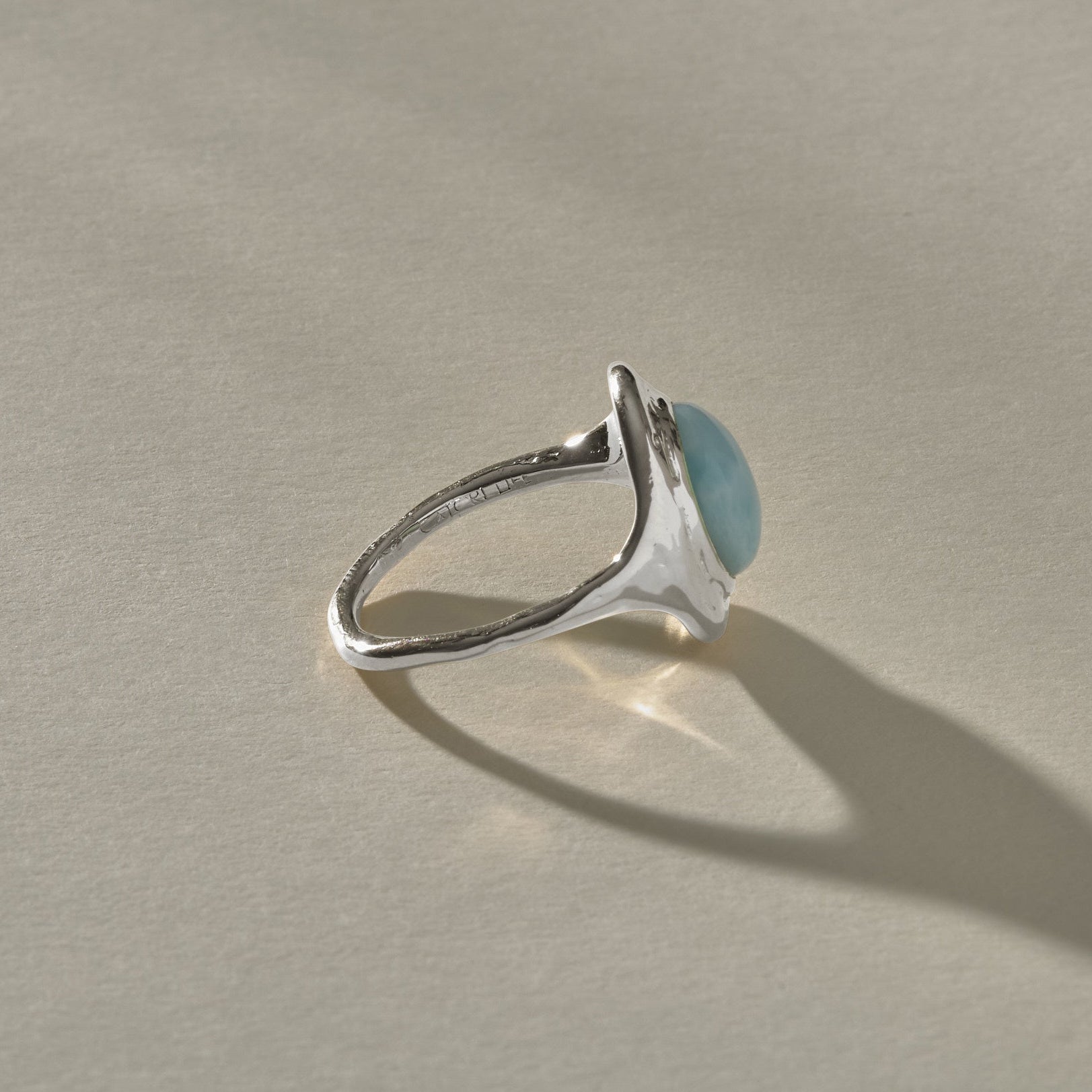 Elysian Larimar Signet Ring in recycled sterling silver from the side, showing the signet profile.