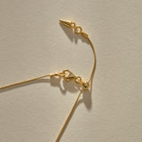 Clasp and adjustable box chain of the Elysian Shell Necklace in bronze.
