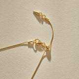 Clasp and adjustable chain of the Elysian Shell Necklace in gold.