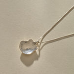 Back of the Elysian Shell Necklace pendant in sterling silver, showing the smooth inside of the shell.