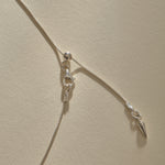 Clasp and adjustable box chain of the Elysian Shell Necklace in sterling silver.