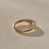 Eros Five-Stone Champagne Diamond Band in solid recycled gold from the back at an angle, showing the smooth inner band.