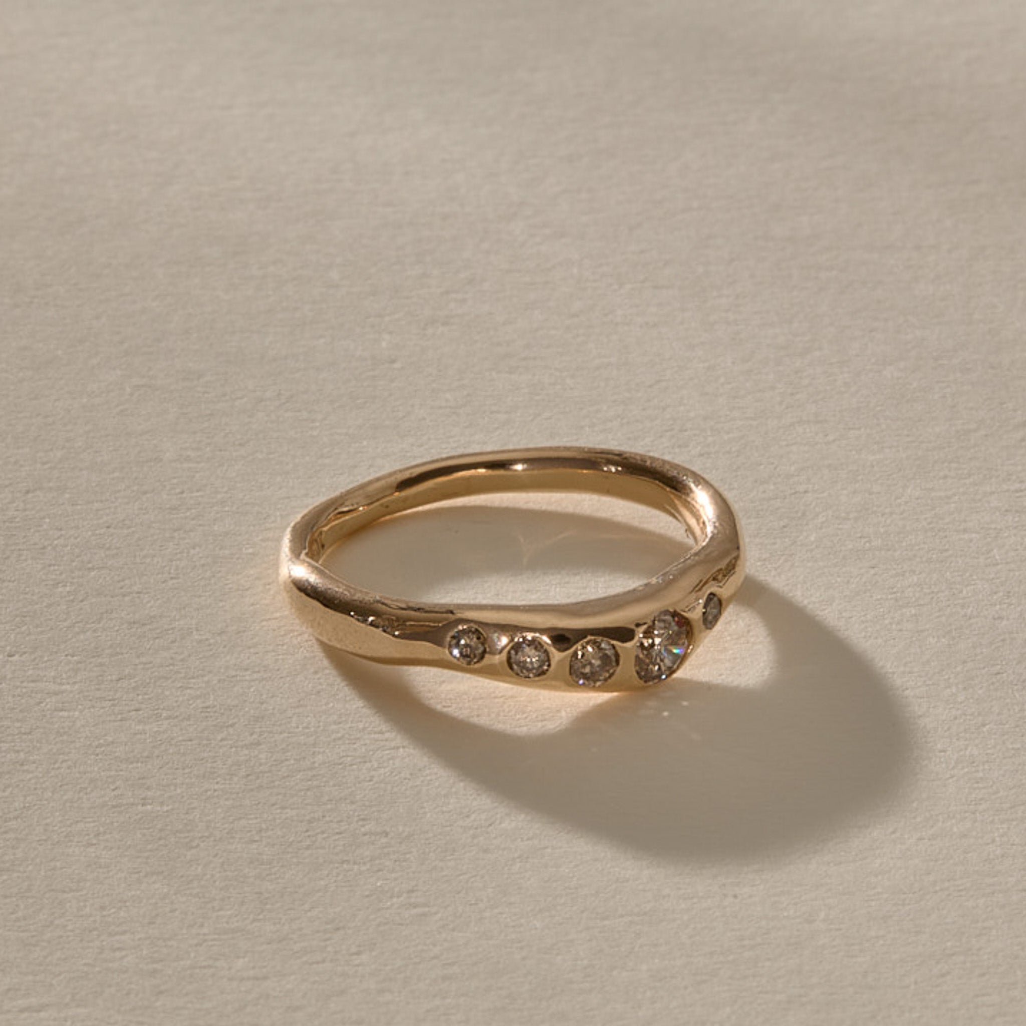 Eros Five-Stone Champagne Diamond Band in solid recycled gold, five champagne diamonds set across an organic band.