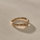 Eros Five-Stone Champagne Diamond Band in solid recycled gold from the side, showing the softly undulating band.