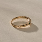 Eros Five-Stone Emerald Band in solid recycled gold from the side, showing the smooth organic band.