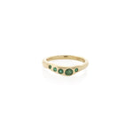 Eros Five-Stone Emerald Band in solid recycled gold on a white background.