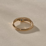 Eros Five-Stone Sapphire Band in solid recycled gold from the back, showing the sapphires through the open settings.