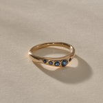 Eros Five-Stone Sapphire Band in solid recycled gold from the side, showing the softly undulating band.