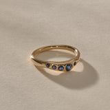 Eros Five-Stone Sapphire Band in solid recycled gold from the side, showing the softly undulating band.