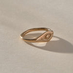 Evil Eye Protection Ring in recycled bronze at an angle, showing the carved protective eye.