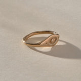 Evil Eye Protection Ring in recycled bronze at an angle, showing the carved protective eye.