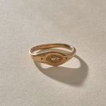 Evil Eye Protection Ring in recycled bronze from the front, showing the carved eye.