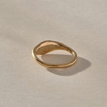 Evil Eye Protection Ring in solid recycled gold from the back at an angle, showing the tapering band.