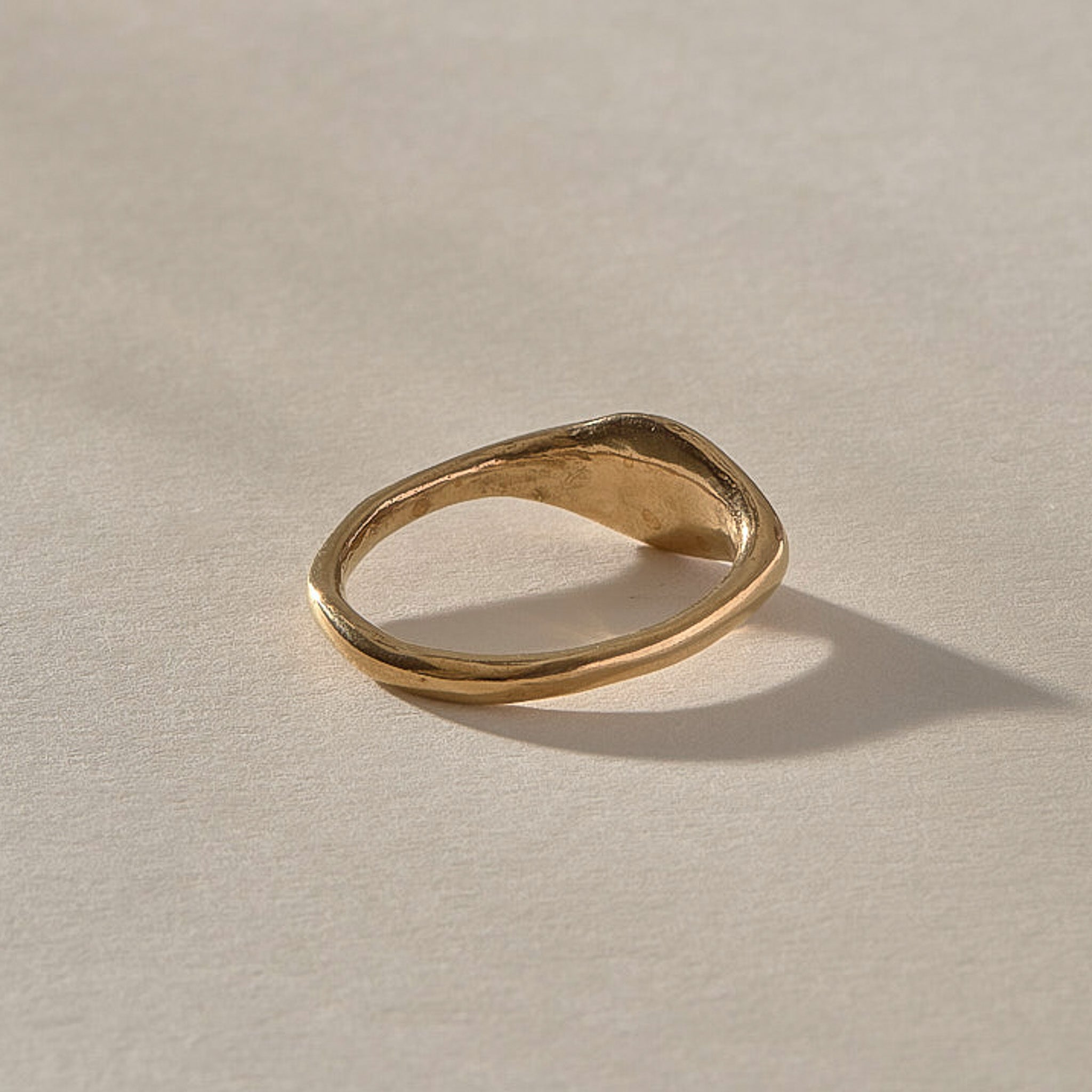 Evil Eye Protection Ring in solid recycled gold from the back, showing the slim band.