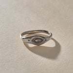 Evil Eye Protection Ring in recycled sterling silver from the front, showing the carved eye.