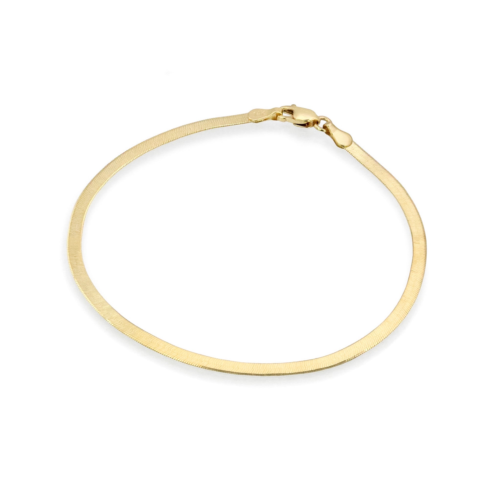 Fehu Herringbone Chain Bracelet in gold on a white background.